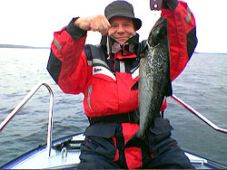 Tuliniemi Holiday Cottages catch a fish on boat fishing